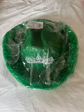 green cowboy hat with feathers and crown